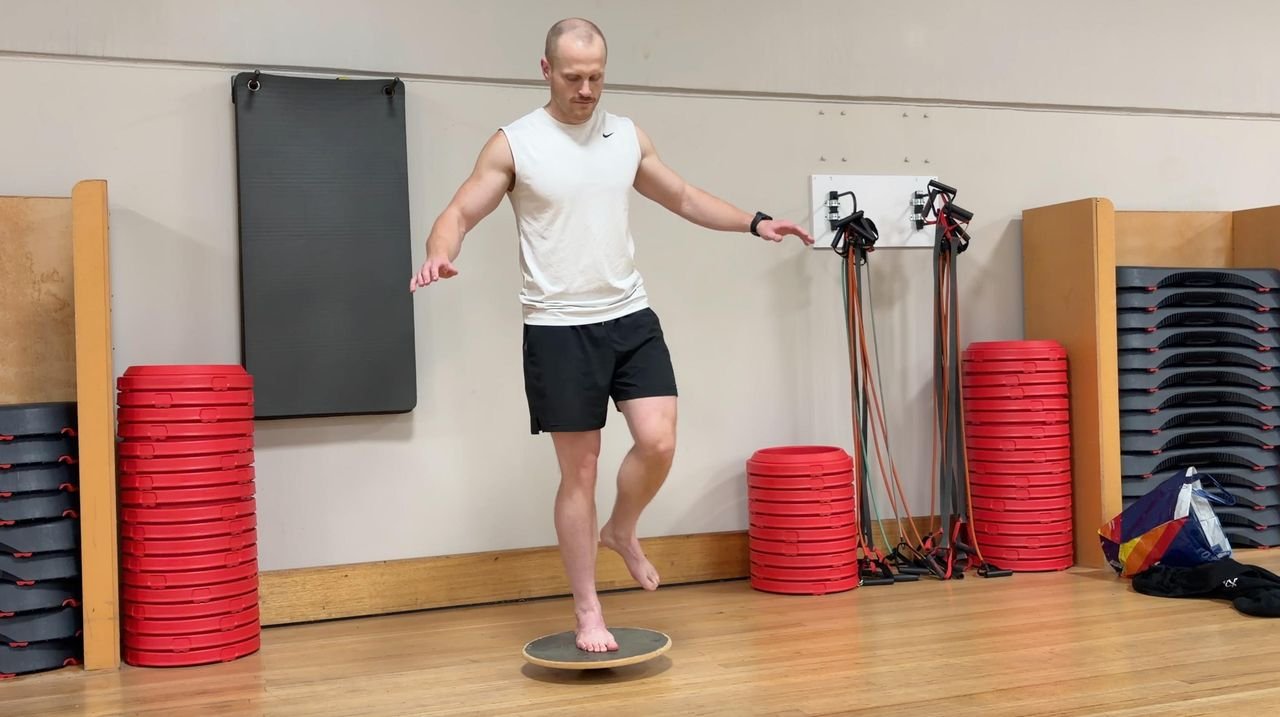 Single leg balance on a wobble board